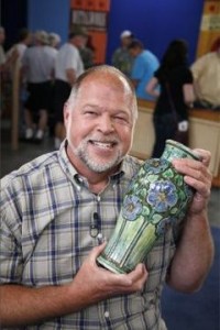 A man shows off a treasure on Antiques Roadshow
